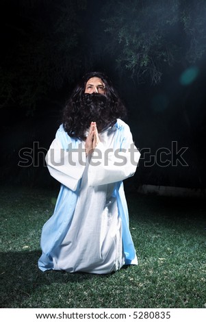Jesus or other holy man praying and looking heavenward.
