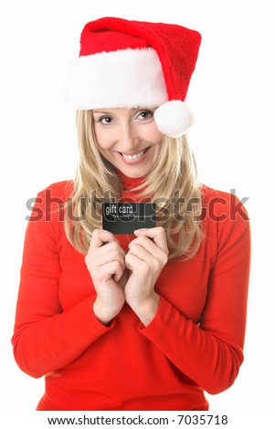 Christmas girl wearing santa hat ready to spend money, holds a gift card,  credit or debit card or other membership or business card.  Insert your own card or replace my text with your own message.