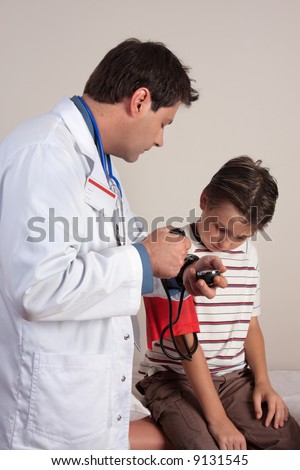 A doctor takes a patients blood pressure
