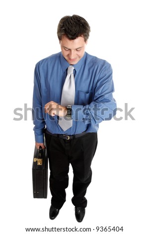 Businessman holding a briefcase checks the time, eg interview, meeting, appointment, running late, overtime.