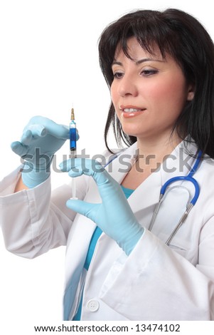 Female doctor or surgeon preparing a syringe needle.