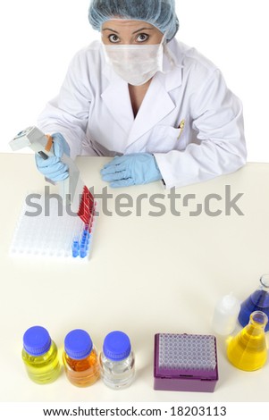 Laboratory worker sitting at desk doing scientific research or testing.
