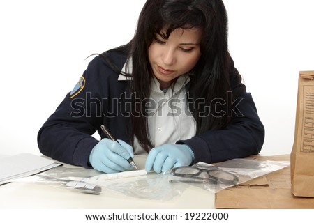 Police crime  detective documents evidence collected from crime scene.