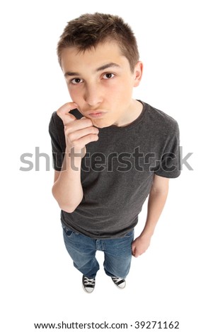 A thinking boy looking up.  He is standing and wearing casual clothes.