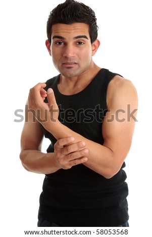 A man, construction worker, builder, fitness instructor or other nursing a sore arm with wincing expression.  White background.