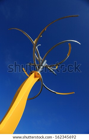 BONDI, AUSTRALIA, NOVEMBER 9,  2013: Sculpture By The Sea, 2013. Sculpture titled \'like a flower swaying in the wind \'  Hiroyuki Kita (Japan).  Medium - stainless steel, ball bearings, paint