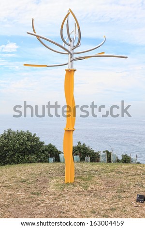 BONDI, AUSTRALIA - NOVEMBER 3,  2013: Sculpture By The Sea,  2013.Titled \'like a flower swaying in the wind \' by Hiroyuki Kita (Japan).  Medium - stainless steel, steel ball bearings, paint  $60000