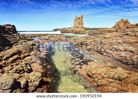 Cathedral Rock Kiama Downs Australia.  There is motion in the fish swimming in the rock pool