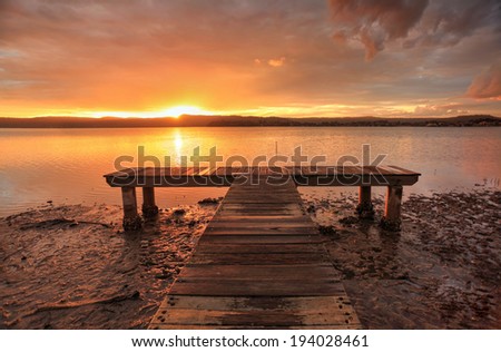 Sunset sky and waters at Green Point.  NSW Australia.  Focus to end of jetty
