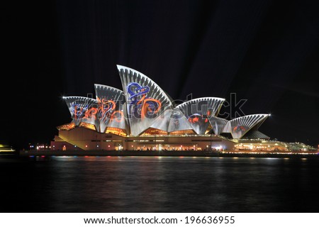 SYDNEY, AUSTRALIA - JUNE 2, 2014; Sydney Opera House illuminated in colourful images during Vivid Sydney.  This is sort of industrial pattern