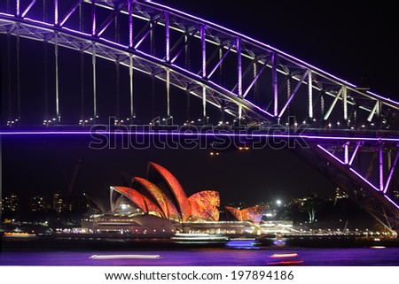 NTH SYDNEY, AUSTRALIA - JUNE 7, 2014; Sydney Harbour Bridge and Opera House in vibrant colours during Vivid Sydney annual festival celebrations.