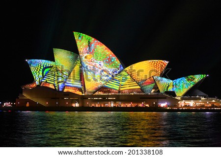 SYDNEY, AUSTRALIA - JUNE 2, 2014; Vivid Sydney Festival, the Sydney Opera House in summery colours of lime green, aqua, yellow and orange intricate patterns for Vivid annual festival