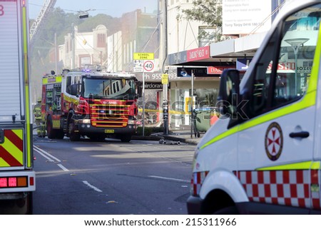 ROZELLE, AUSTRALIA - SEPTEMBER 4, 2014;   Fire search and rescue teams and ambulance crew attend the shop blast tragedy in Darling Street, Rozelle.