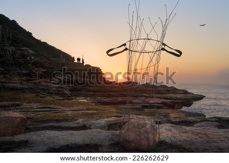 BONDI, AUSTRALIA - OCTOBER 23, 2014; Sculpture by the Sea Annual free public event 2014.  Exhibit titled Cycle 90 - A Premonition of Wind  by artist Kaoru Matsumoto, Japan,