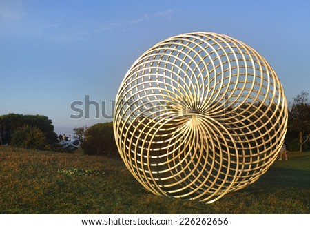 BONDI, AUSTRALIA -  OCTOBER 25, 2014; Sculpture by the Sea Annual Event 2014.  Sculpture titled Sisyphus by George Andric, SA.  Materials, stainless steel.  Price $36000