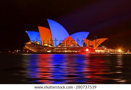 SYDNEY, AUSTRALIA - MAY 22, 2015; Sydney Opera House illuminated with red and blue sails imagery during the Vivid Sydney 2015 annual public event.