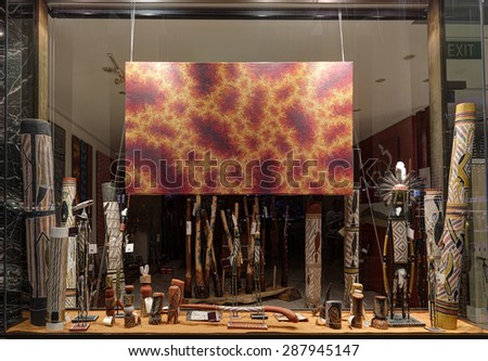 SYDNEY, AUSTRALIA - MAY 27, 2015;  Retail shop window display at Circular Quay Sydney where tourists and locals can buy handcrafted aboriginal objects such as didgeridoos , woomeras and paintings