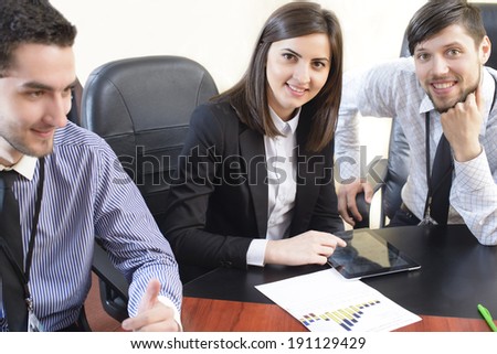 Business people having a board meeting at an office.