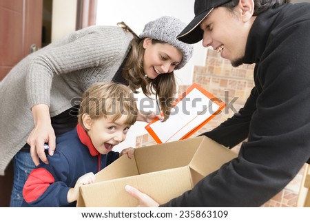 Courier Delivering a Package to a happy boy