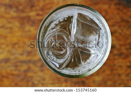 Soda With Water And Ice In The Glass Cup; Top View