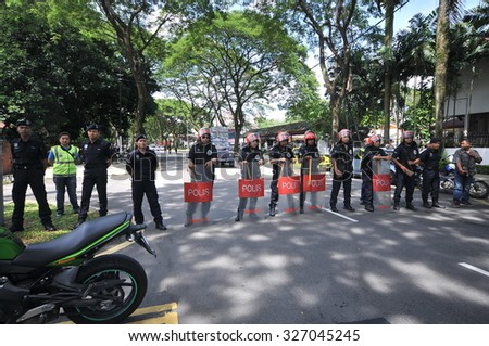 KUALA LUMPUR, MALAYSIA - MAY 31ST 2013: The Police and security blocking the road to prevent the Syrian and Malaysian protestants to demonstrate in front of Syria Embassy in Kuala Lumpur, Malaysia.