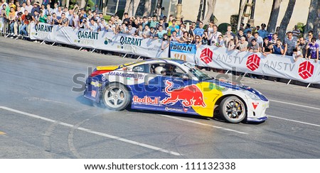 AZERBAIJAN, BAKU - JUNE 17: Ukrainian Drift Champion Alex Grinchuk drive the Nissan 350Z, Red Bull Racing Drift Team, Red Bull Showrun Parade, June 17, 2012 in Baku, Azerbaijan