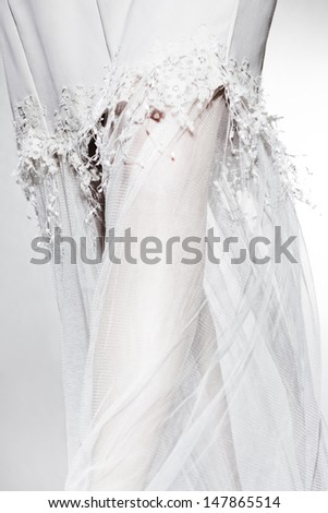 Beautiful woman legs in wedding dress