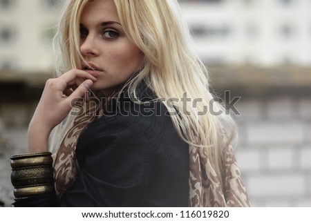 Portrait Of A Beautiful Blonde Outdoor On The Street