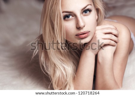 portrait of beautiful girl lying down, clean skin