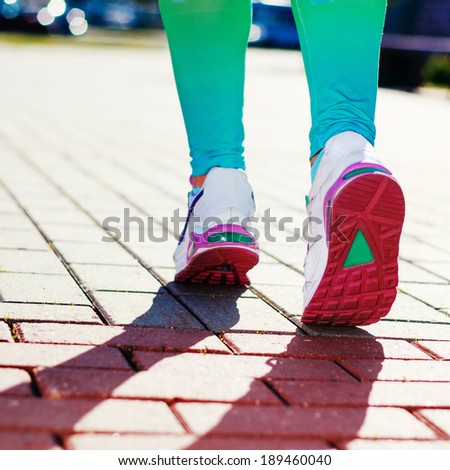 Runner Feet Running on road Closeup in shoe. woman fitness workout  concept