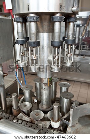 A winery capping and labeling bottle machine