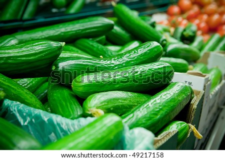 Picture of fresh cucumber, tomatoes and other vegetables in supermarket