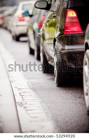 Typical scene during rush hour. A traffic jam with rows of cars. Shallow depth of field.
