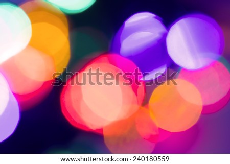 Festive Christmas lights background. Defocused Bokeh twinkling Lights Festive holiday party background with blurry special magic effect.
