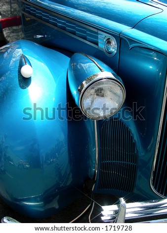 Head lamp, turn signal, and blue body on 1940 antique automobile