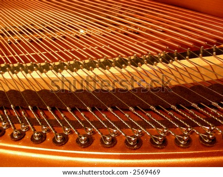 Strings and inner workings of a baby grand piano