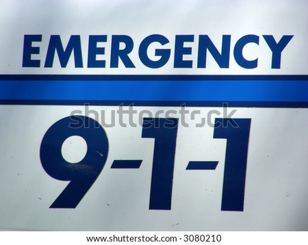 Dial 911 sign on side of emergency vehicle