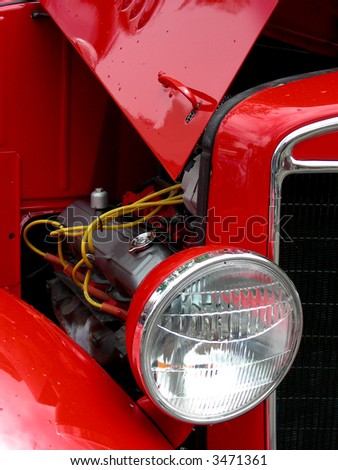 Open hood and V8 engine in 1936 antique automobile