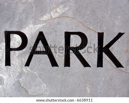 Municipal park sign carved in solid rock