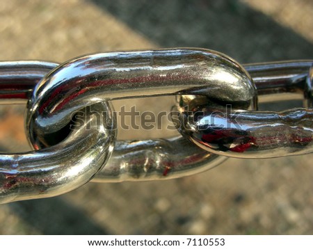 One full and two partial links of a chain fence