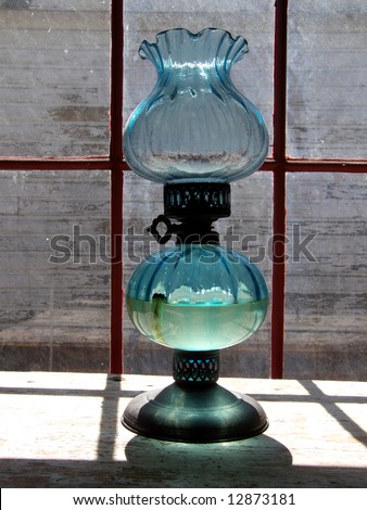 Old fashioned oil lamp in historic pioneer cabin