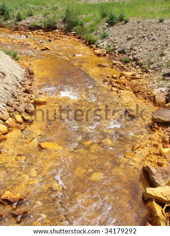Stream with high iron content in the Rocky Mountains