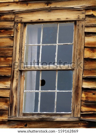 Broken window in abandoned stagecoach station in Colorado
