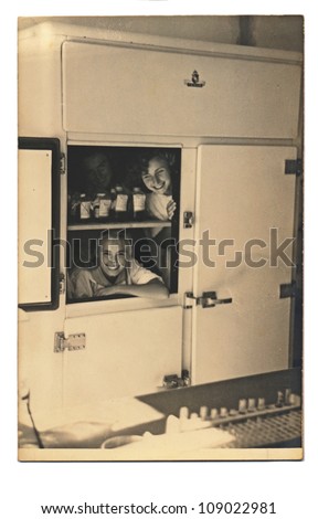 PRAGUE, CZECHOSLOVAK REPUBLIC, CIRCA 1950 - young women are hiding in an old cabinet (laboratory since 1950) - circa 1950