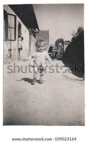 PLOVDIV, BULGARIA, CIRCA 1945 - an child learns to walk - circa 1945