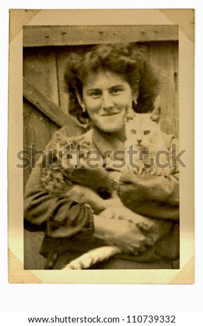 Central Bohemia, CZECHOSLOVAKIA, CIRCA 1955 - middle aged woman with cat - circa 1955