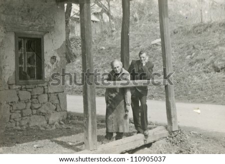 VELKY LOM, CZECHOSLOVAKIA, CIRCA 1980 - old blacksmith with his son in law of the old village smithy - circa 1980