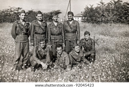 soldiers in the middle of flowers field - photo scan - about 1960