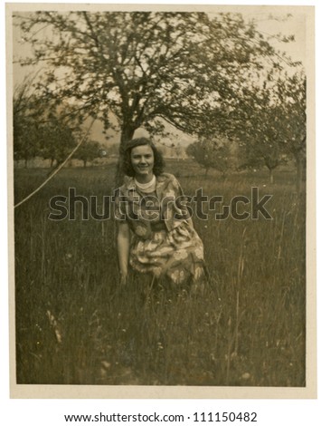 CENTRAL BULGARIA, BULGARIA,- CIRCA 1950: the area Karlovo - young woman in the orchards - circa 1950