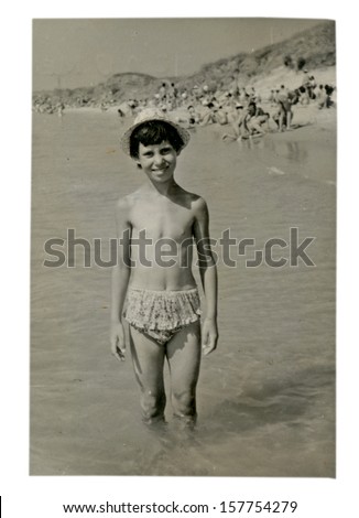 AREA OF THE BLACK SEA COAST, BULGARIA - CIRCA 1955 - unidentified Child, girl, in a swimsuit on a family photo - Note: slight blurriness, better at smaller sizes - circa 1955